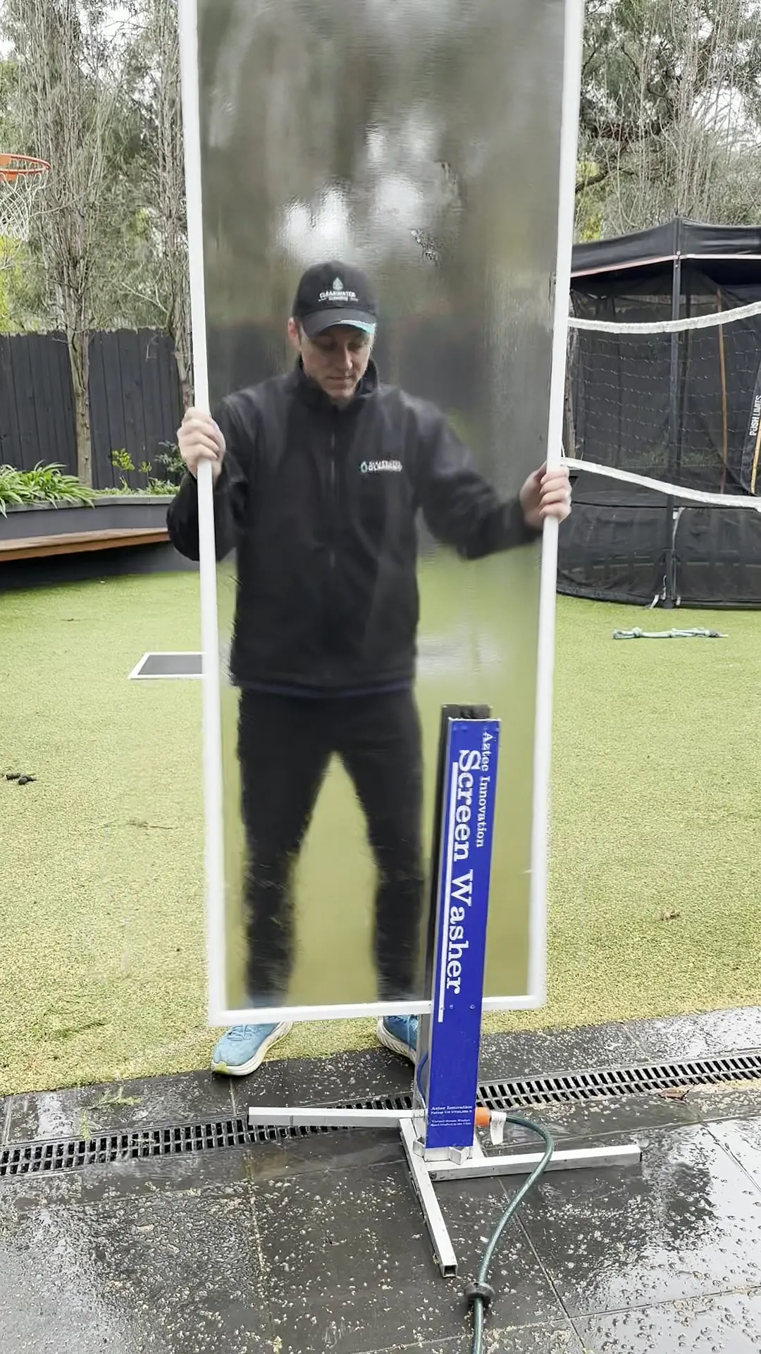 Fly screen being washed on a purpose-built screen-washing rig