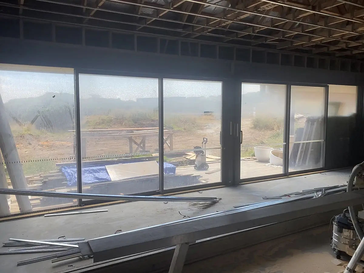 Windows and doors in an unfinished build before the final clean